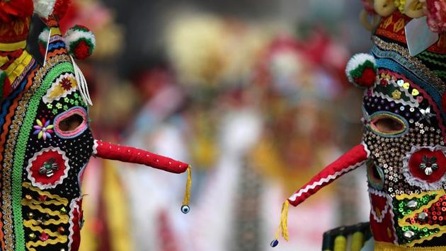 Dancers wearing masks take part in the International Festival of Masquerade Games on Sunday. (REUTERS) Dancers wearing masks take part in the International Festival of Masquerade Games on Sunday. (REUTERS)