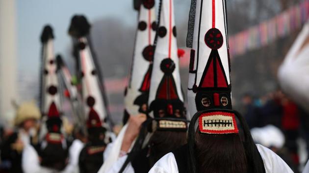 Dancers wearing masks take part in the 25th edition of the international festival of masquerade games on Sunday. (REUTERS) Dancers wearing masks take part in the 25th edition of the international festival of masquerade games on Sunday. (REUTERS)