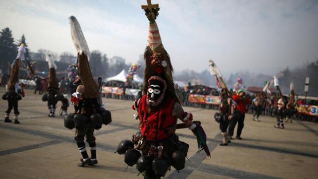Dancers wearing masks take part in the International Festival of Masquerade Games on Sunday. The three-day festival, which started on Friday, has participants sporting multi-coloured masks, covered with beads, ribbons and woolen tassels while the main dancer, ladened with bells to drive away sickness and evil spirits, sways like a wheat spikelet heavy with grain. (REUTERS) Dancers wearing masks take part in the International Festival of Masquerade Games on Sunday. The three-day festival, which started on Friday, has participants sporting multi-coloured masks, covered with beads, ribbons and woolen tassels while the main dancer, ladened with bells to drive away sickness and evil spirits, sways like a wheat spikelet heavy with grain. (REUTERS)
