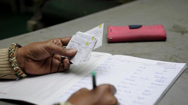 A coupon of Rs 500 for purchase of grocery items being distributed by a factory management in Noida. (Sunil Ghosh / HT File Photo) A coupon of Rs 500 for purchase of grocery items being distributed by a factory management in Noida. (Sunil Ghosh / HT File Photo)