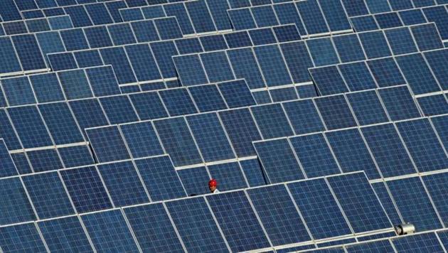A file photo of rows of solar panel in a solar power plant in China. (REUTERS) A file photo of rows of solar panel in a solar power plant in China. (REUTERS)
