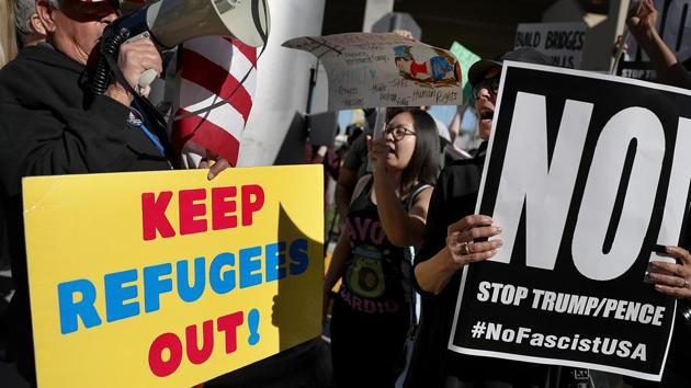 A protester faces off with a supporter of US President Donald Trump during a demonstration against the immigration ban that was imposed by President Trump at Los Angeles International Airport on January 29 in Los Angeles, California. (AFP Photo) A protester faces off with a supporter of US President Donald Trump during a demonstration against the immigration ban that was imposed by President Trump at Los Angeles International Airport on January 29 in Los Angeles, California. (AFP Photo)