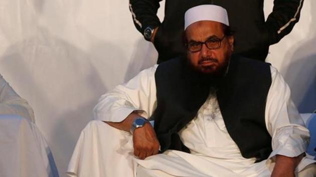 Hafiz Muhammad Saeed, chief of the Islamic charity organization Jamaat-ud-Dawa (JuD), sits during a rally against India and in support of Kashmir, in Karachi, Pakistan, December 18, 2016.(REUTERS File Photo) Hafiz Muhammad Saeed, chief of the Islamic charity organization Jamaat-ud-Dawa (JuD), sits during a rally against India and in support of Kashmir, in Karachi, Pakistan, December 18, 2016.(REUTERS File Photo)