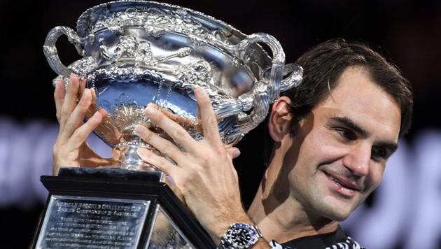 Switzerland's Roger Federer celebrates with the championship trophy during the Australian Open awards ceremony after his victory against Rafael Nadal.(AFP) Switzerland's Roger Federer celebrates with the championship trophy during the Australian Open awards ceremony after his victory against Rafael Nadal.(AFP)