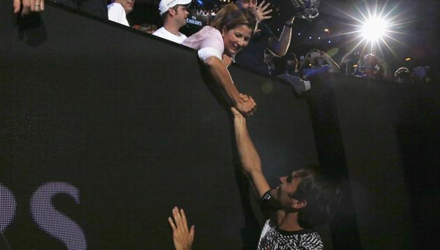 Roger Federer celebrates with wife Mirka after winning his fifth Australian Open title. (REUTERS)