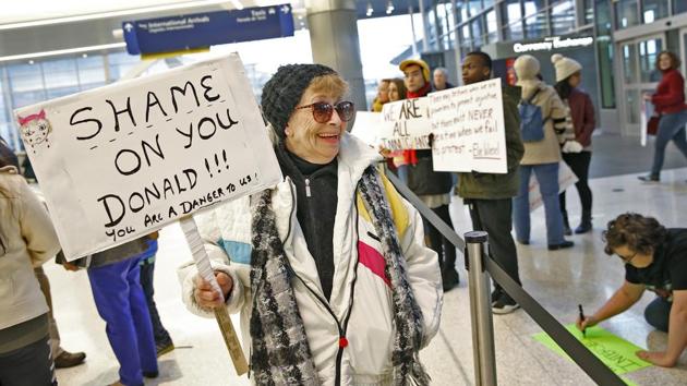 Deanna Culley gets ready for a protest against President Donald Trump's executive order temporarily suspending all immigration for citizens of seven majority Muslim countries for 90 days at the Indianapolis International Airport. (Kelly Wilkinson/AP) Deanna Culley gets ready for a protest against President Donald Trump's executive order temporarily suspending all immigration for citizens of seven majority Muslim countries for 90 days at the Indianapolis International Airport. (Kelly Wilkinson/AP)