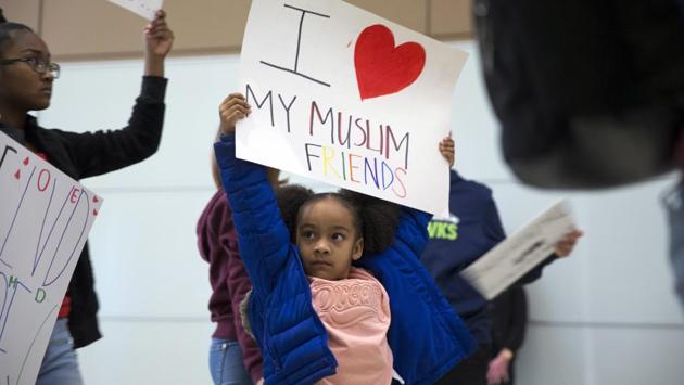 Deana Stevenson, 5, protests President Donald Trump's immigration order during a rally at McCarran International Airport in Las Vegas. (Steve Marcus/AP) Deana Stevenson, 5, protests President Donald Trump's immigration order during a rally at McCarran International Airport in Las Vegas. (Steve Marcus/AP)