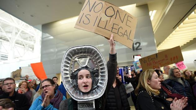 Al Schneider (C) shouts along with protesters at San Francisco International Airport in San Francisco, California. US President Donald Trump issued an executive order yesterday barring citizens of seven Muslim-majority countries from entering the United States for the next 90 days and suspends the admission of all refugees for 120 days. (Josh Edelson/AFP) Al Schneider (C) shouts along with protesters at San Francisco International Airport in San Francisco, California. US President Donald Trump issued an executive order yesterday barring citizens of seven Muslim-majority countries from entering the United States for the next 90 days and suspends the admission of all refugees for 120 days. (Josh Edelson/AFP)