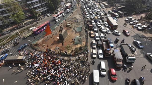 Protesters sit on the road near Panjarpol, Chembur, on Tuesday. Besides reservation, the community has been demanding the review of the Scheduled Castes and Tribes (Prevention of Atrocities) Act, strictest punishment for the Kopardi rape accused, construction of Shivaji statue in Arabian sea, implementation of the recommendation of the Swaminathan Commission on agrarian crisis among others. (Vijayanand Gupta/HT )