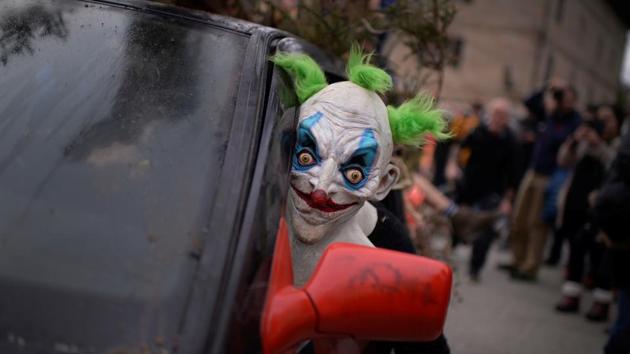 A masked reveller looks out from a car during carnival celebrations in Ituren. (REUTERS PHOTO) A masked reveller looks out from a car during carnival celebrations in Ituren. (REUTERS PHOTO)