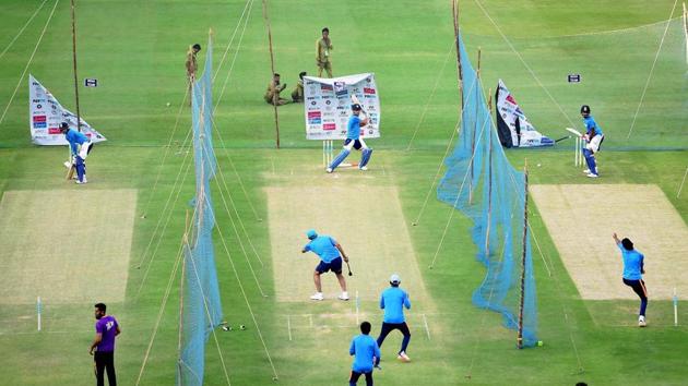 MS Dhoni has a bat during the practice session in Bangalore. (PTI) MS Dhoni has a bat during the practice session in Bangalore. (PTI)
