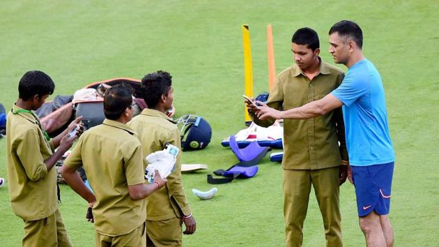 MS Dhoni interacts with the ground staff as skipper Virat Kohli opted to skip the practice session. (PTI) MS Dhoni interacts with the ground staff as skipper Virat Kohli opted to skip the practice session. (PTI)