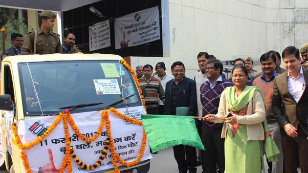 In a move to enlighten voters about the VVPAT (voter-verified paper audit trail) machine, which will be exclusively used in Ghaziabad assembly constituency, the administration officials on Tuesday flagged off a van carrying a VVPAT machine(Sakib Ali/ HT Photo)