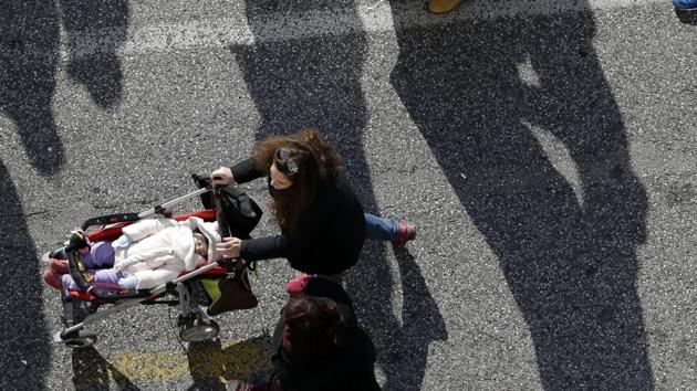 A woman pushes a stroller with a baby. (AP Photo/ Representative image) A woman pushes a stroller with a baby. (AP Photo/ Representative image)