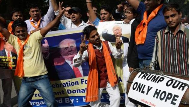Right-wing activists of India's Hindu Sena celebrate the victorious outcome for US Republican presidential candidate Donald Trump in the US presidential elections in New Delhi on November 9, 2016. A far-right Hindu group which has been one of Donald Trump's most avid overseas cheerleaders began celebrating in New Delhi Wednesday as the Republican pulled off a shock US presidential election victory. / AFP PHOTO / PRAKASH SINGH (AFP) Right-wing activists of India's Hindu Sena celebrate the victorious outcome for US Republican presidential candidate Donald Trump in the US presidential elections in New Delhi on November 9, 2016. A far-right Hindu group which has been one of Donald Trump's most avid overseas cheerleaders began celebrating in New Delhi Wednesday as the Republican pulled off a shock US presidential election victory. / AFP PHOTO / PRAKASH SINGH (AFP)