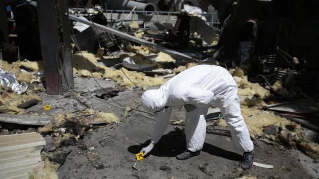 A forensic expert examines the scene at Alsonidar Group's water pump and pipe factory after it was hit by Saudi-led airstrikes in Sanaa, Yemen in October, 2016. (AP file photo) A forensic expert examines the scene at Alsonidar Group's water pump and pipe factory after it was hit by Saudi-led airstrikes in Sanaa, Yemen in October, 2016. (AP file photo)