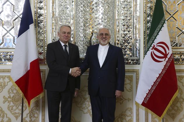 Iranian foreign minister Mohammad Javad Zarif (right) and his French counterpart Jean-Marc Ayrault shake hands prior to their meeting in Tehran on Tuesday. (AP) Iranian foreign minister Mohammad Javad Zarif (right) and his French counterpart Jean-Marc Ayrault shake hands prior to their meeting in Tehran on Tuesday. (AP)