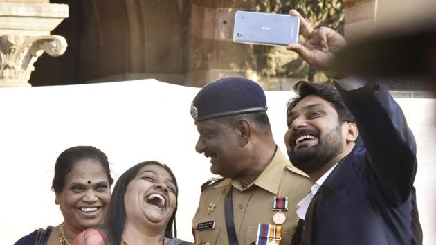 A million dollar smile: Balkrishna Desai celebrates his victory with his family. (Anshuman Poyrekar/HT PHOTO) 