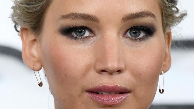 Jennifer Lawrence poses during a photocall to promote the forthcoming film Passengers in London. (REUTERS)