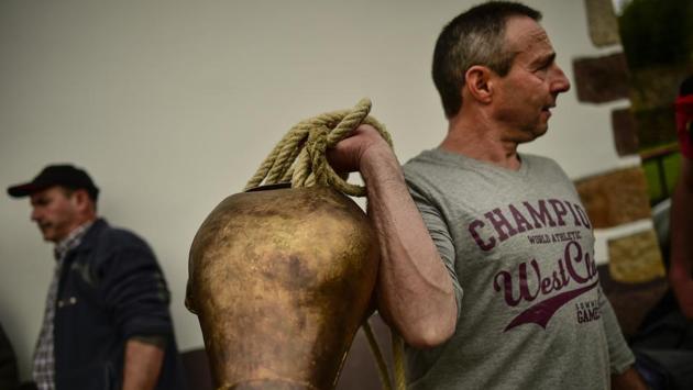 A man holds up a cowbell before taking part in the carnival between the Pyrenees villages of Ituren and Zubieta, northern Spain. (AP photo) A man holds up a cowbell before taking part in the carnival between the Pyrenees villages of Ituren and Zubieta, northern Spain. (AP photo)
