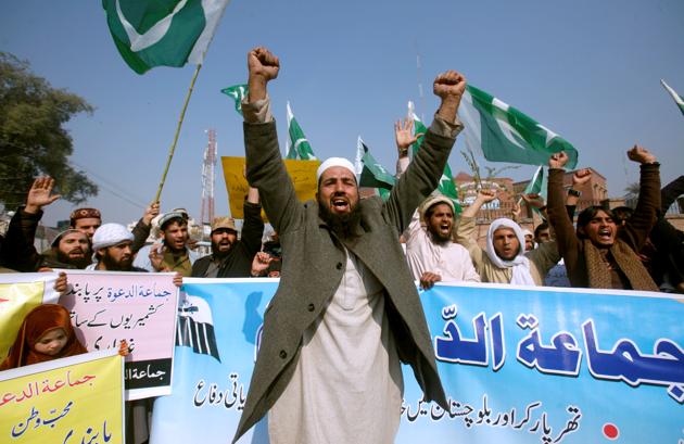 Jamaat-ud-Dawa (JuD) supporters in Peshawar chant slogans to condemn the house arrest of their chief Hafiz Saeed. (Reuters) Jamaat-ud-Dawa (JuD) supporters in Peshawar chant slogans to condemn the house arrest of their chief Hafiz Saeed. (Reuters)