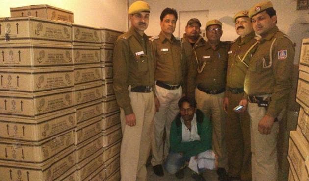 Delhi Police found at least 300 cartons each containing 50 quarter bottles of illicit liquor made in Haryana. Delhi Police found at least 300 cartons each containing 50 quarter bottles of illicit liquor made in Haryana.