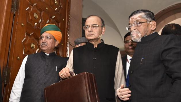 Finance minister Arun Jaitley with MoS Arjun Ram Meghwal and Santosh Gangwar arrives in the Parliament to present the Union budget.(Arvind Yadav/HT Photo)