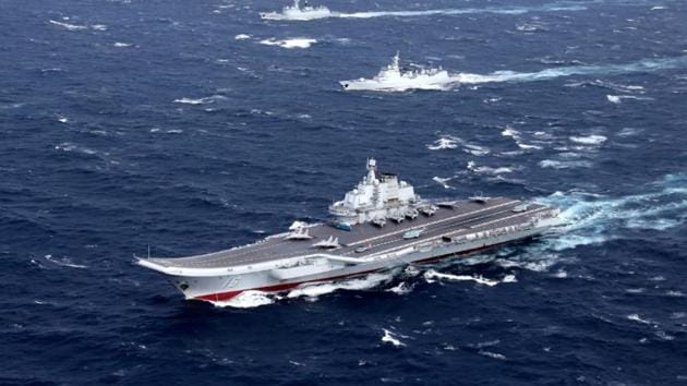 China's Liaoning aircraft carrier with accompanying fleet conducts a drill in an area of South China Sea, in this undated photo taken December, 2016. REUTERS/Stringer/Files China's Liaoning aircraft carrier with accompanying fleet conducts a drill in an area of South China Sea, in this undated photo taken December, 2016. REUTERS/Stringer/Files