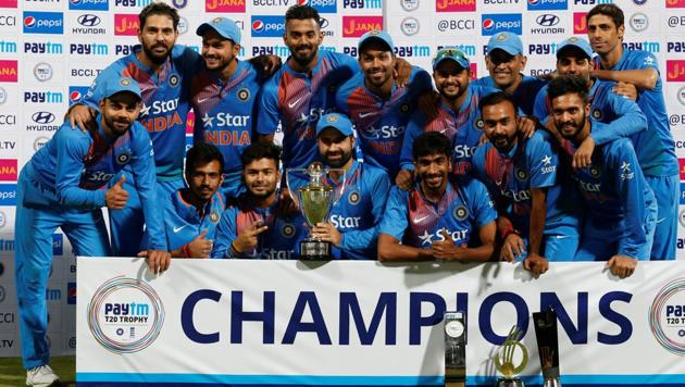 India cricket team players pose with the trophy after winning the T20 series against England. (REUTERS)
