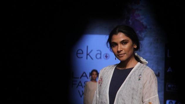 A model walks the ramp on Day 1 of Lakmé  Fashion Week Summer /Resort 2017at at Jio Garden at Bandra Kurla Complex at Jio Garden at Bandra Kurla Complex.  The first day showcased  a sense of drama, glitz and  ultra-glam outfits that emphasised on design and  varied colour tones throughout the collection. Since its inception, Lakmé Fashion Week has set its sights on new trends, strived to promote young talent, taken the lead on the digital front, kick-started fresh conversations on beauty and has transformed India’s premier fashion week into a global platform. (Pramod Thakur/HT PHOTO) 