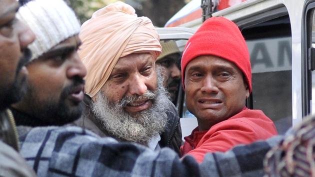 Family members of Maur car blast victims at CMC Hospital in Ludhiana on Wednesday.(Gurminder Singh/HT)