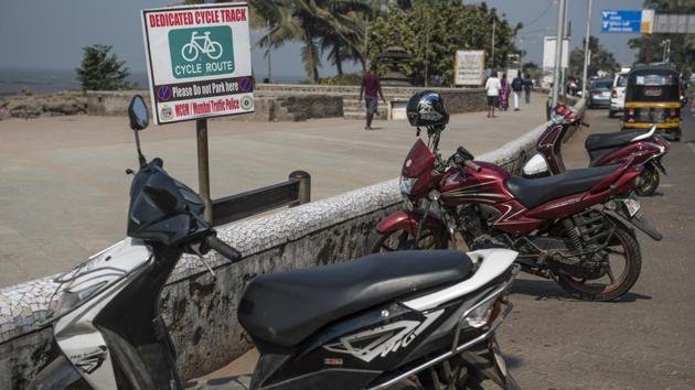 Vehicles parked on the dedicated cycling track at Carter Road, Bandra, on Tuesday.(Satish Bate/HT)