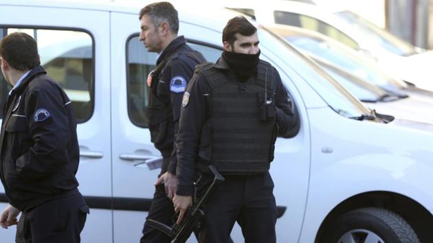 Armed police officers stand outside Istanbul's Cerrahpasa hospital, Wednesday Feb. 1, 2017.(AP)