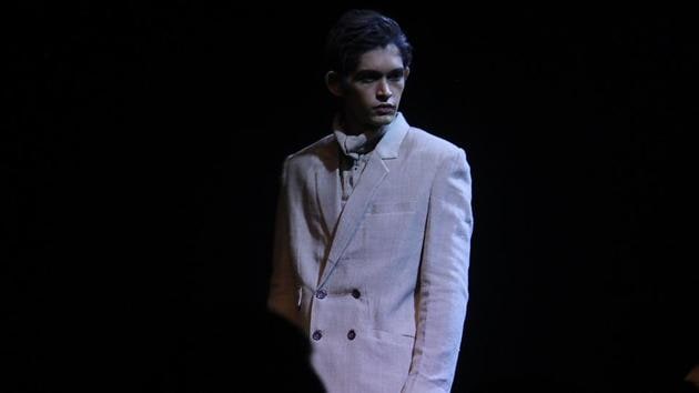 A model  poses in a  Anuj Bhutani creation on Day 1 of Lakmé  Fashion Week Summer /Resort 2017 at Jio Garden at Bandra Kurla Complex.  Anuj Bhutani’s ‘Reboot’ label made an impression and his creativity moved into the sustainable fashion territory for men and women, but he kept true to the theme, as he used an assortment of jute, khadi and cotton in earthy tones. (Pramod Thakur/HT PHOTO) 