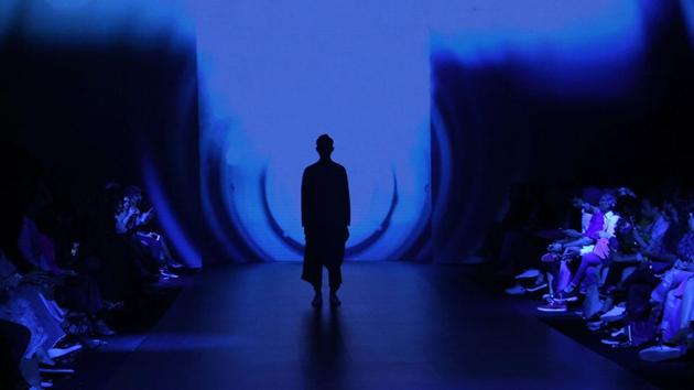 A silhouette of a model walking the ramp  for the Antar Agni  show on Day 1 of Lakmé  Fashion Week Summer /Resort 2017 at Jio Garden at Bandra Kurla Complex. The ‘Antar-Agni’ label by Ujjawal Dubey has acquired quite a loyal following among the trend setters of both sexes. His unconventional creativity with great construction techniques has made Ujjawal’s garments conversation pieces. (Pramod Thakur/HT PHOTO) 