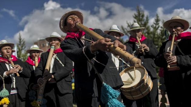 Musicians perform for dancers on the shores of Lake Titicaca, as they practice for the Virgin of Candelaria celebrations in Puno, Peru. UNESCO declared the festival a cultural landmark in 2015. (Rodrigo Abd / AP)