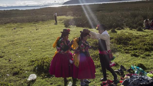 Dancers get ready near Lake Titicaca prior to their performance at Virgin of Candelaria celebrations in Puno, Peru. The festivities start this week. (Rodrigo Abd/ AP)
