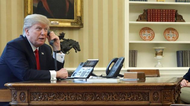 US President Donald Trump, speaks on the phone with in the Oval Office at the White House in Washington.(Reuters File Photo)