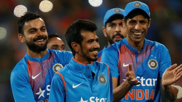 India cricket team skipper Virat Kohli and players applaud Yuzvendra Chahal (centre) after his Man-of-the-Match performance in the third T20I vs England cricket team in Bengaluru on Wednesday. (REUTERS) India cricket team skipper Virat Kohli and players applaud Yuzvendra Chahal (centre) after his Man-of-the-Match performance in the third T20I vs England cricket team in Bengaluru on Wednesday. (REUTERS)
