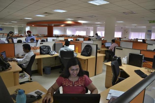 Employees work at the Indian headquarters of iGate in the southern Indian city of Bangalore. (Reuters)
