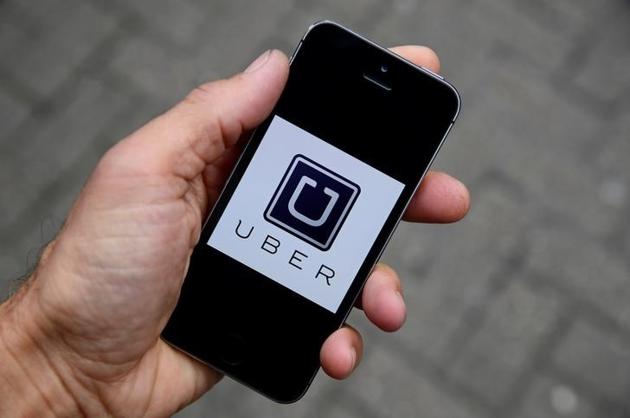 The Uber app logo is seen on a mobile telephone in this October 28, 2016 photo illustration. REUTERS/Toby Melville/Illustration/File Photo The Uber app logo is seen on a mobile telephone in this October 28, 2016 photo illustration. REUTERS/Toby Melville/Illustration/File Photo
