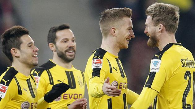 Dortmund's Marco Reus, 2nd right, celebrates his side's opening goal during a Bundesliga match against FSV Mainz 05. (AP) Dortmund's Marco Reus, 2nd right, celebrates his side's opening goal during a Bundesliga match against FSV Mainz 05. (AP)