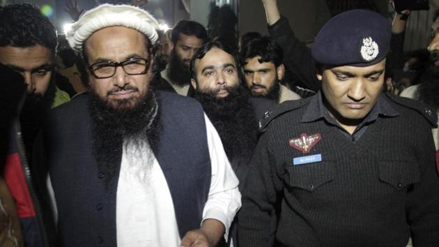 A Pakistani police officer escorts Lashkar-e-Taiba founder Hafiz Saeed in Lahore on January 30, 2017 after the government issued orders for his “preventive detention”. (AP) A Pakistani police officer escorts Lashkar-e-Taiba founder Hafiz Saeed in Lahore on January 30, 2017 after the government issued orders for his “preventive detention”. (AP)
