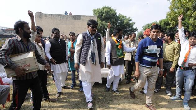 BJP candidate for Jewar assembly segment Thakur Dhirendra Singh, who came second on a Congress ticket in the 2012 polls, campaigned at Mirzapur village on Thursday.(Sunil Ghosh/HT Photo)