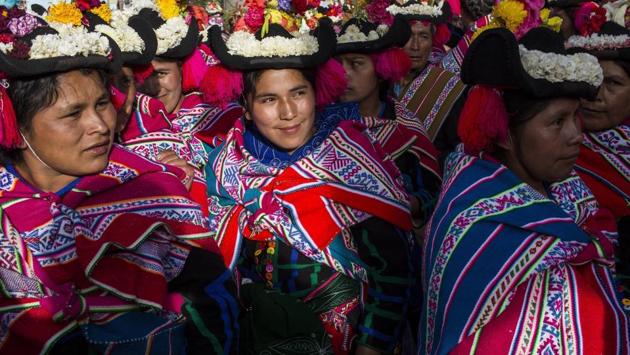 Dancers wait for their turn to perform during Virgin of Candelaria celebrations in Puno, Peru. In addition to devotion, villagers have different reasons to dance during the feast. Some are grateful to have been cured of disease, while others ask for protection for their crops, or increase in political power. (Rodrigo Abd / AP)