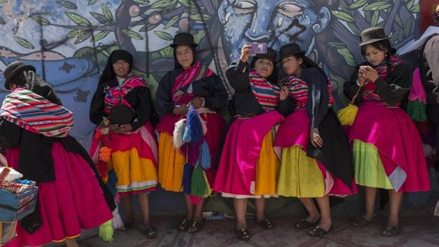 Dancers take selfies after performing during Virgin of Candelaria celebrations in Puno, Peru. The festival of La Candelaria is being celebrated in Puno every year since the 18th century. The Virgin of Candlemas is one of various representations of the famed Virgin Mary. The Catholic feast day is celebrated on February 2 to honour the purification of the Virgin Mary, forty days after the birth of Jesus. (Rodrigo Abd / AP)