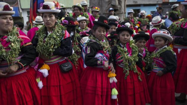 Dancers waiting for their turn to perform during Virgin of Candelaria celebrations in Puno, Peru. Anthropologist Henry Flores, who has studied indigenous dances in the town of Puno, said "There’s always been a lack of respect for the countryside. But when the villagers participate, they are saying, ‘I am present’ and the people from the city are only spectators." (AP Photo/Rodrigo Abd)