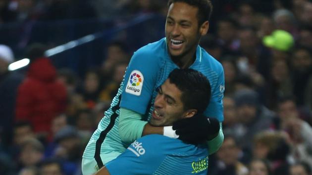 FC Barcelona's Luis Suarez celebrates with Neymar (top) after scoring the opening goal against Atletico Madrid in their Spanish Copa del Rey (King’s Cup) semifinal first leg match at the Vicente Calderon stadium in Madrid. (AP) FC Barcelona's Luis Suarez celebrates with Neymar (top) after scoring the opening goal against Atletico Madrid in their Spanish Copa del Rey (King’s Cup) semifinal first leg match at the Vicente Calderon stadium in Madrid. (AP)