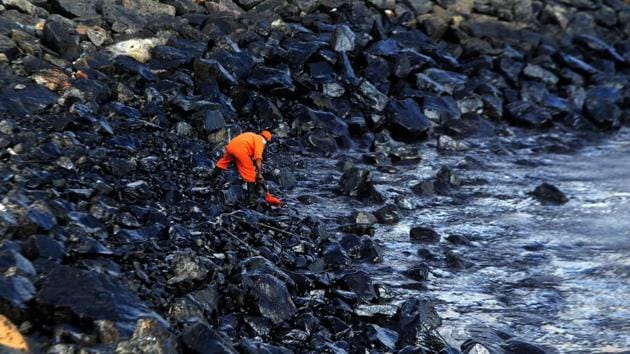 A member of the Pollution Response Team of the Indian Coast Guard collects a sample of the oil spill from boulders at the Ennore coast, in Chennai. (Arun Sarkar/AFP) A member of the Pollution Response Team of the Indian Coast Guard collects a sample of the oil spill from boulders at the Ennore coast, in Chennai. (Arun Sarkar/AFP)