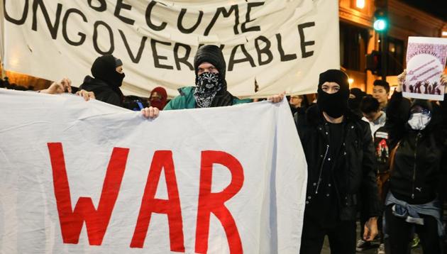 People protesting controversial Breitbart writer Milo Yiannopoulos take to the streets in Berkeley, California. (AFP Photo) People protesting controversial Breitbart writer Milo Yiannopoulos take to the streets in Berkeley, California. (AFP Photo)